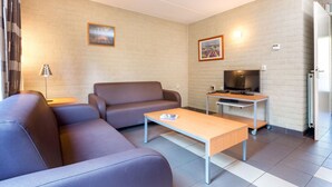 Bungalow | Living room | DVD player - Comfortable Bungalow With Whirlpool Near the Vrachelse Heide (Oosterhout)