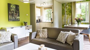 Bungalow | Living room - Garden-view Bungalow With a Fireplace, in the Veluwe (Epe)