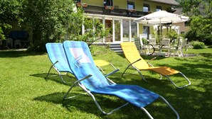 A house with a balcony and a patio area with outdoor furniture. - Cozy Apartment in Feld am See near Ski Slopes (Feld am See)