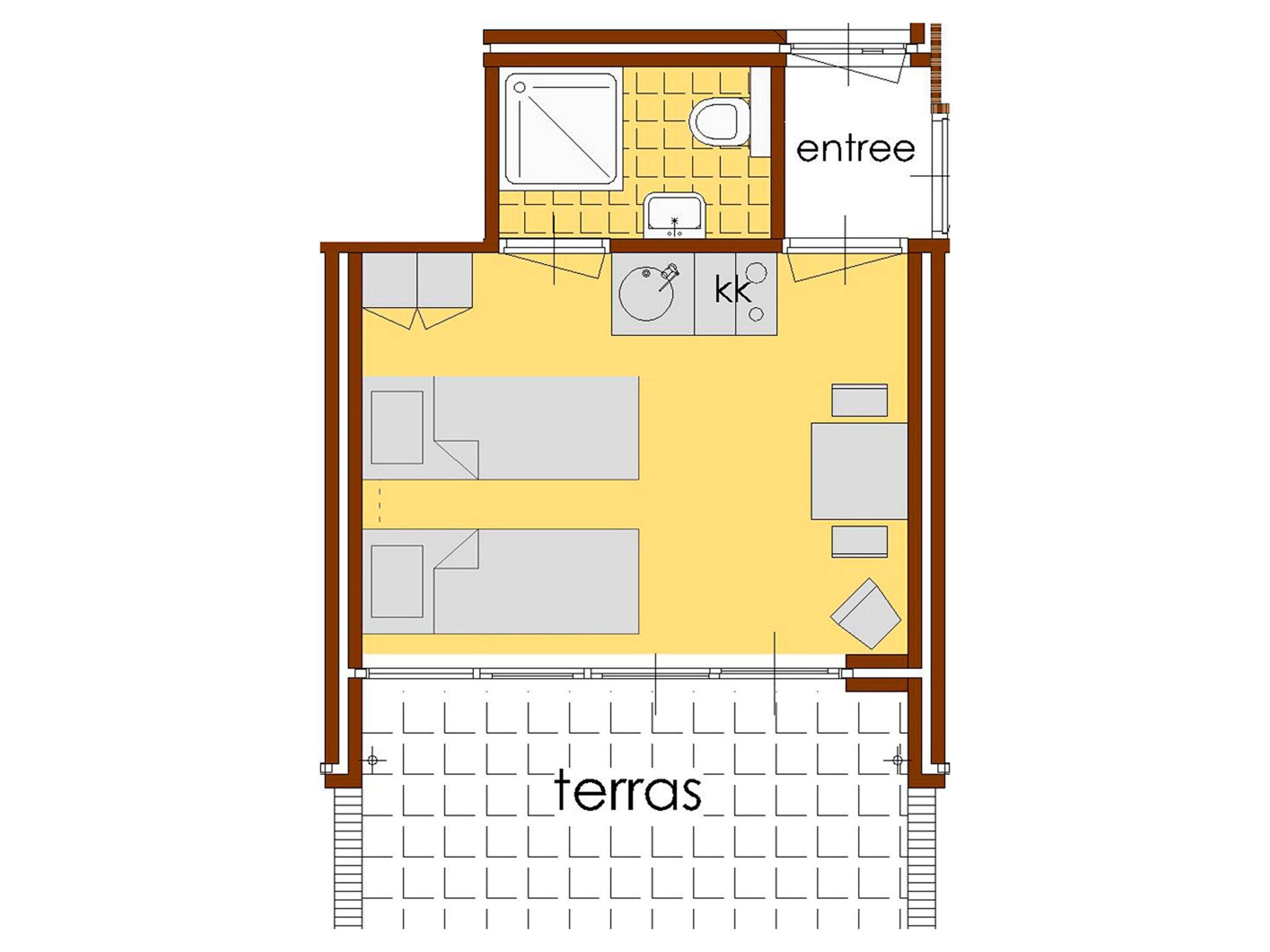 A floor plan of a hotel room with a bathroom, kitchenette, and a living area.