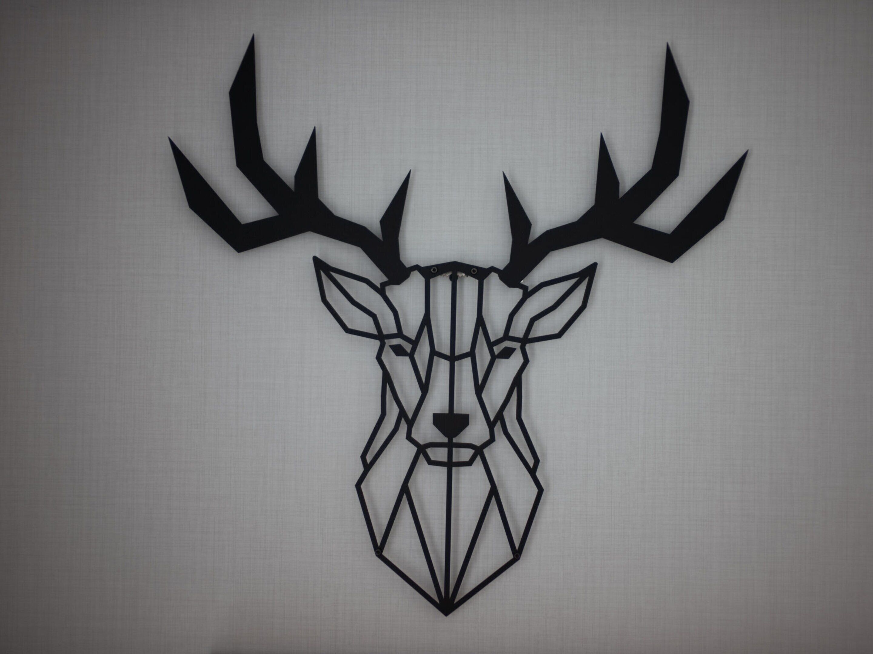 A geometric deer head wall art.