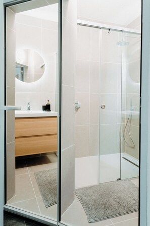 Shower, hair dryer, towels, soap