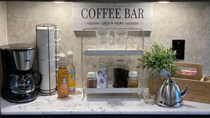 A coffee bar setup with a coffee maker, espresso machine, and a sign indicating it's open 24 hours. - Fully sanitized with bbq & lawn, super soft linens, safe, country setting (Arroyo Grande)