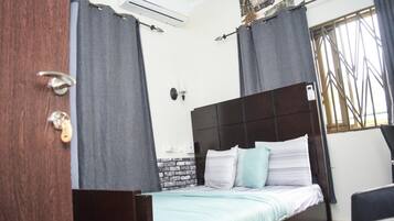 Premium bedding, desk, laptop workspace, iron/ironing board