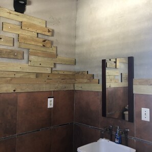 Shower, hair dryer, towels, toilet paper