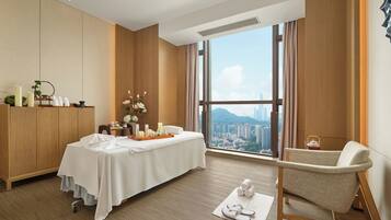 Enjoy a panoramic view of the city and mountains from the comfort of this stylish room.