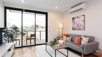 Two Bedroom Apartment With Parking | Living room | 49-inch Smart TV with digital channels, TV