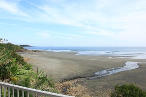 On the beach, black sand