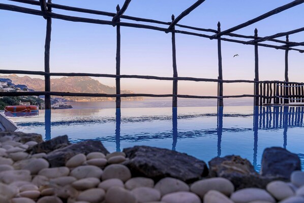 Seasonal outdoor pool, open 8:00 AM to 6:30 PM, pool umbrellas