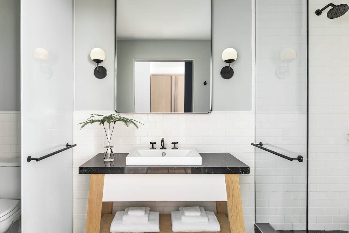 designer toiletries, hair dryer, towels, soap