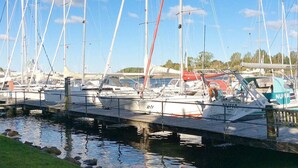 A marina with multiple sailboats docked at wooden piers. - Holiday Home in Kappeln (Kappeln)