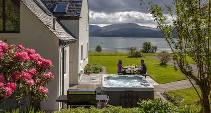 Large cottage on shore of Scottish Loch