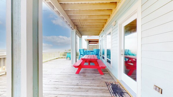 Enjoy a tranquil outdoor space with a deck, picnic table, and ocean views.