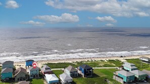 Enjoy the ocean view from your accommodations in a serene beachfront setting.