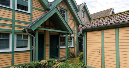 Cozy Holiday Home with Wood Burning Stove near Water