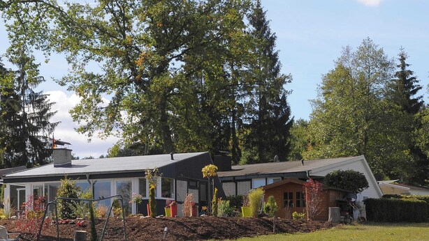A residential property with a large house, a smaller attached structure, and a well-maintained garden. - Chalet in Gerolstein Forest Holiday Park (Gerolstein)