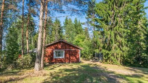 A small, single-story cabin surrounded by dense forest. - Kiviaho by Interhome (Parikkala)