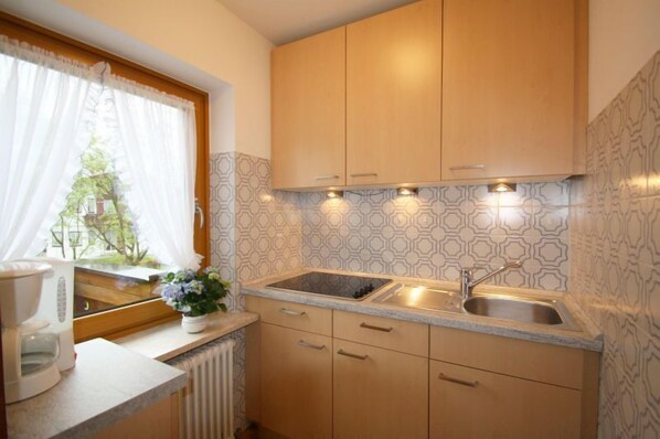 Fridge, microwave, stovetop, coffee/tea maker