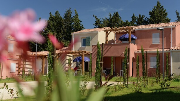 A residential building with multiple balconies, a pergola, and outdoor seating areas. - Apartment in Le Paradou With Pool & Sauna (Paradou)