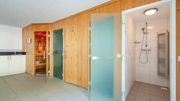 Enjoy a minimalist retreat with a shower area, separate bathroom, and kitchenette.