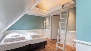 A bedroom with a loft bed, a ladder, and a door leading to another room. - Holiday Home in Beemster by Windmill (Middenbeemster)