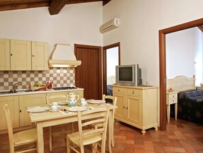 Cottage | Private kitchen | Fridge, highchair