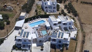 A modern residential complex with a central swimming pool, multiple buildings, and a landscaped area. - Comfy Apartment with Balcony near Puglia Beach (Ostuni)