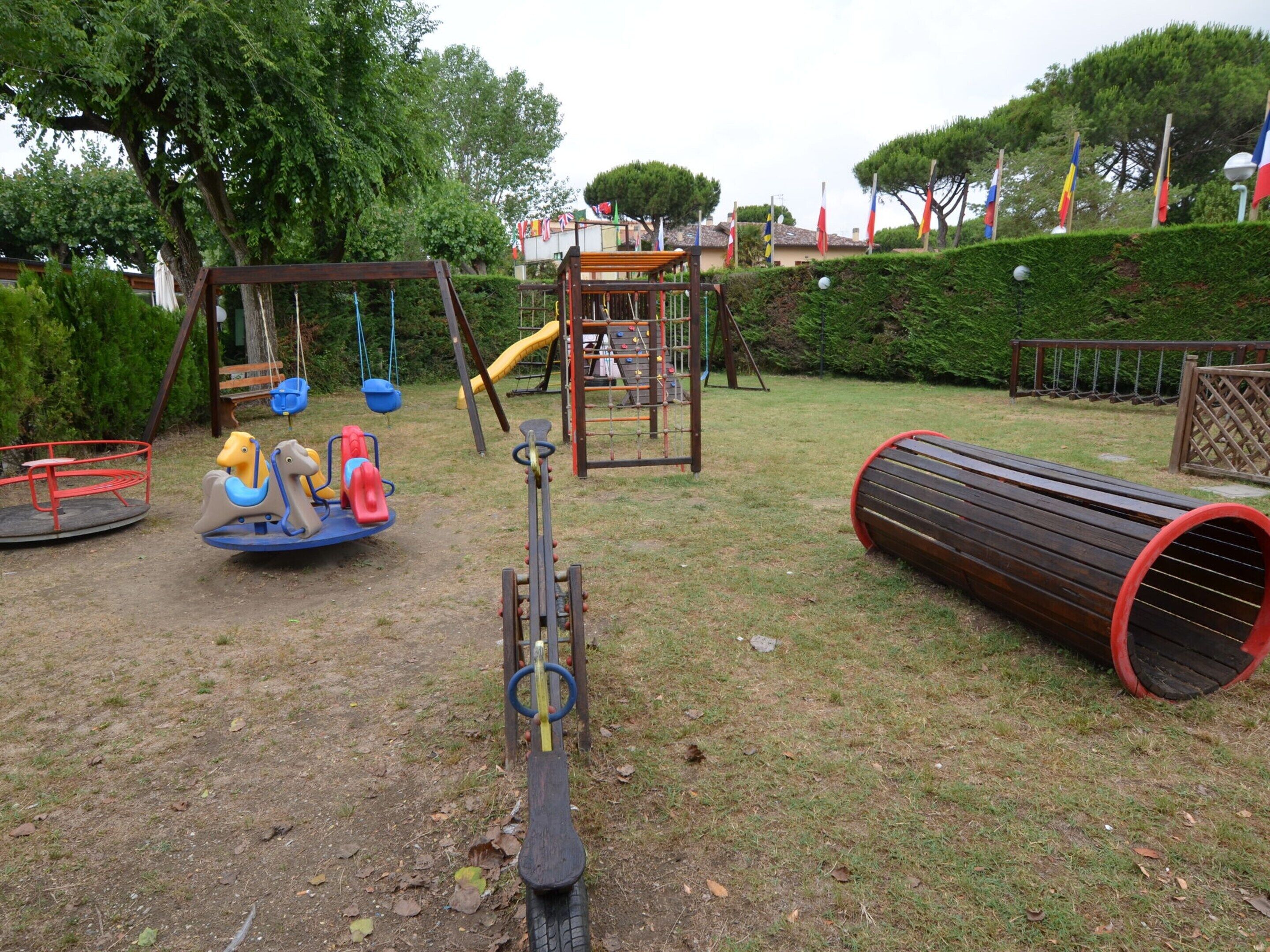 A playground with swings, slides, and a climbing structure.