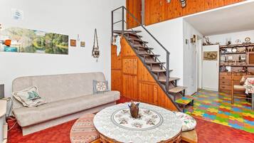 Comfort House | Living area | 32-inch TV with cable channels