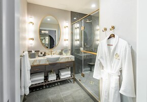 Shower, designer toiletries, hair dryer, bathrobes
