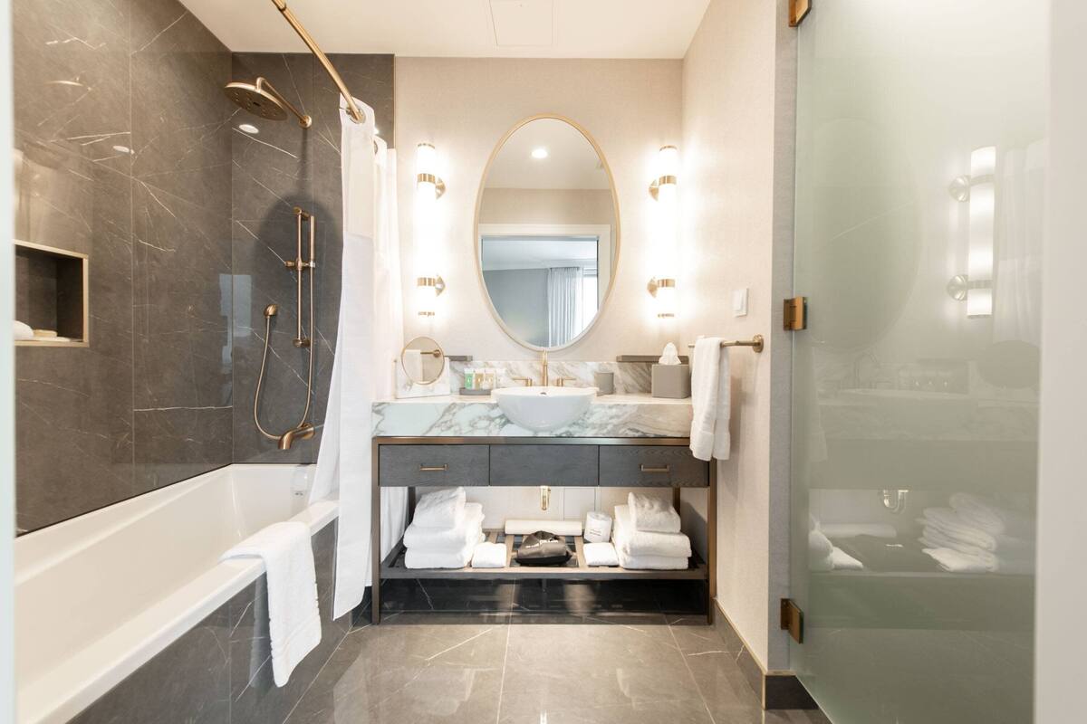 executive suite, 1 king bed with sofa bed (with tub) | bathroom | shower, designer toiletries, hair dryer, bathrobes