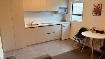 Family Suite | Private kitchen | Fridge, microwave, stovetop, electric kettle