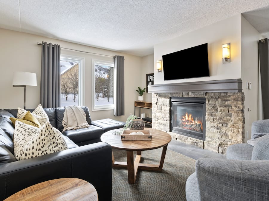 Superior Condo, 3 Bedrooms (117 Mountain Walk - Pet Friendly) | Living area | 50-inch LED TV with cable channels, TV, fireplace