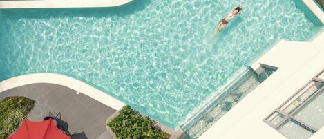 Outdoor pool, open 6:00 AM to 10:00 PM, pool umbrellas, pool loungers
