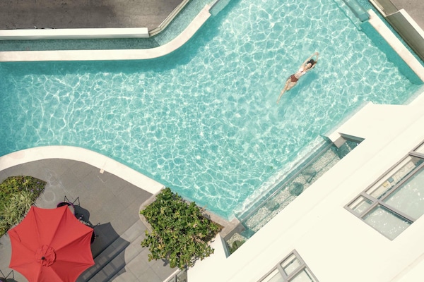 Outdoor pool, open 6:00 AM to 10:00 PM, pool umbrellas, pool loungers