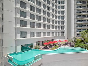 Outdoor pool, open 6:00 AM to 10:00 PM, pool umbrellas, pool loungers