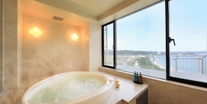 Separate bathtub and shower, free toiletries, hair dryer, slippers