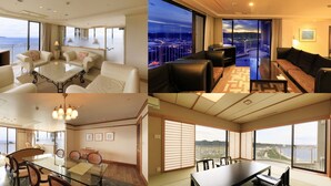 Una suite de hotel con comedor, sala de estar y balcón con vistas a la ciudad.