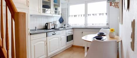 Fridge, oven, dishwasher, coffee/tea maker