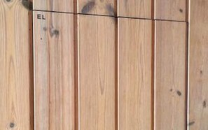 A wooden panel wall with a horizontal line and the letter 'EL' visible. - 4 Person Holiday Home in Karrebaeksminde-by Traum (Karrebæksminde)