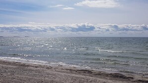 A beach with a clear sky and calm sea. - 4 Star Holiday Home in Karrebaeksminde (Karrebæksminde)
