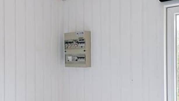A white wall with a utility panel mounted on it. - 4 Person Holiday Home in Lokken (Lokken)