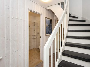 A staircase leading to a bathroom with a shower and a toilet. - Holiday Home in Wendtorf (Wendtorf)