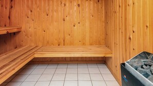 A sauna room with wooden walls and a tiled floor. - 9 Person Holiday Home in Lokken-by Traum (Lokken)
