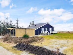 A modern house with a large deck and a covered porch. - Exquisite Holiday Home in Løgstør near Sea (Logstor)