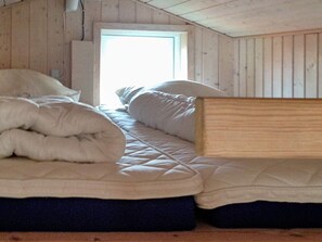 A room with a bed, a window, and a door. - 6 Person Holiday Home in Tranekaer (Tranekaer)