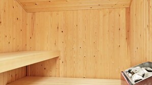 A wooden sauna room with two benches and a red container. - 9 Person Holiday Home in Millinge (Millinge)