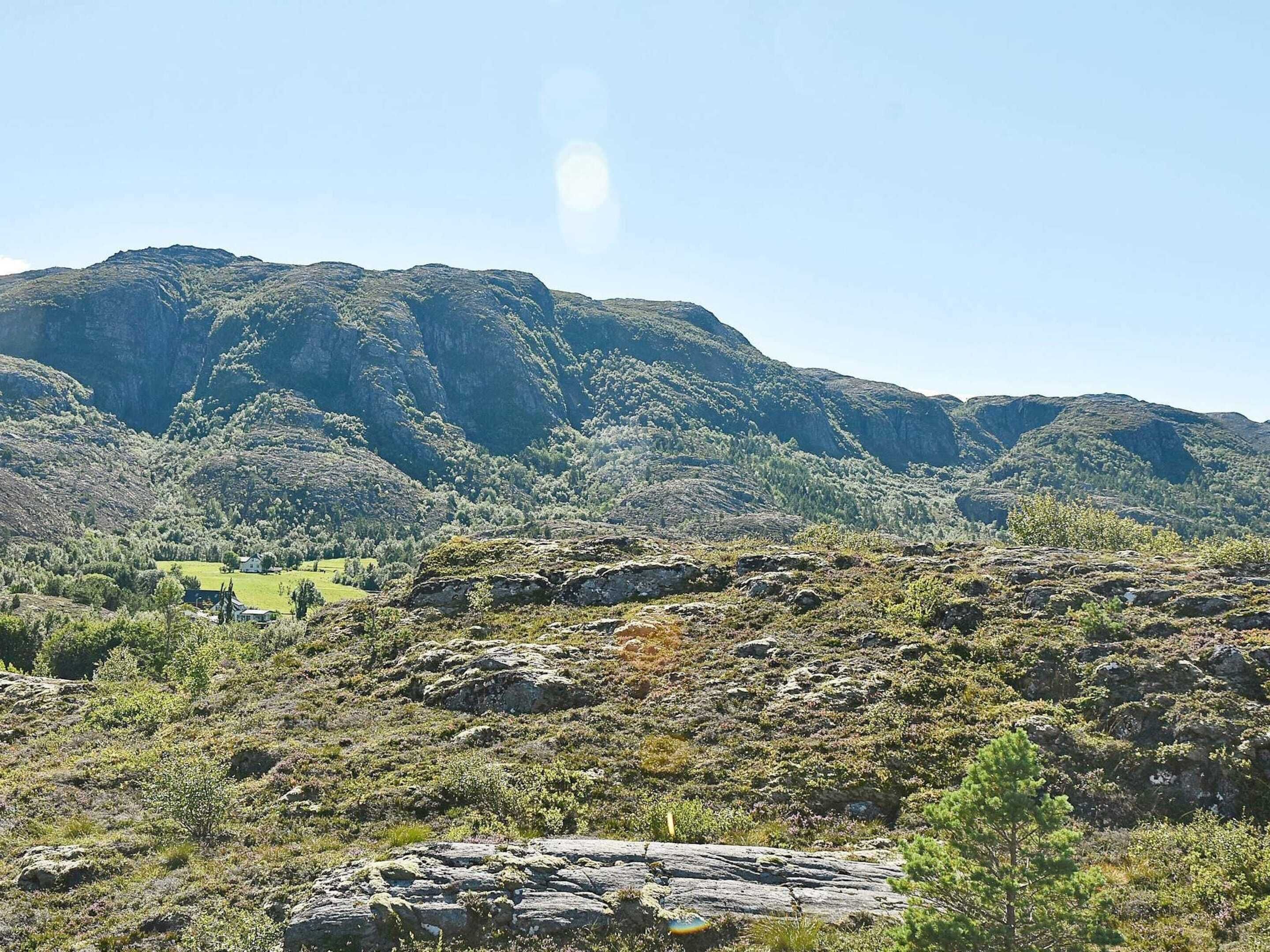 A mountainous landscape with rocky terrain and sparse vegetation.