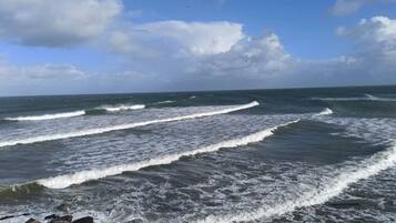 A rocky shoreline with waves.