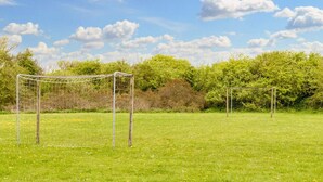 A soccer field with two goals and a clear blue sky. - 5 Star Holiday Home in Vestervig (Vestervig)